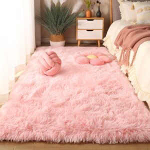 Shaggy pastel pink area rug